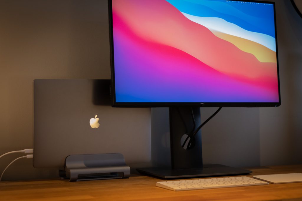 16" MacBook Pro on a Satechi vertical stand behind my monitor